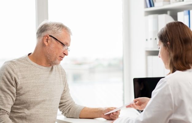 an middle age man is meeting a doctor - ca | Hormone Replacement Therapy For Men | Who Qualifies as Candidate for Hormone Replacement Therapy?